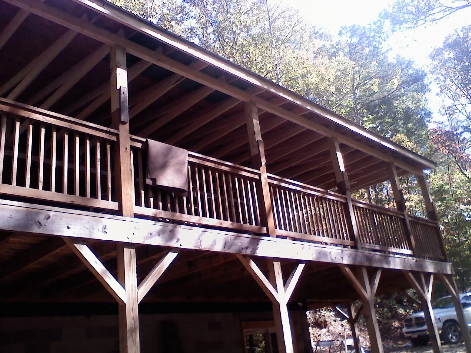 Timber framing under a new elevated porch and deck — Roof Leak Repair in East Waterboro by Roofing Brothers